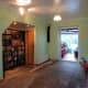 Side view showing alcove under the stairs and door to the cloakroom