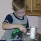 My great-nephew carefully measuring out sugar for a recipe. 