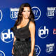 Kim Kardashian in a little black dress and high heels