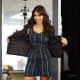 Kim Kardashian wearing a romper and high heels