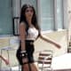 Kim Kardashian on the town in a black mini skirt and pretty high heels showing her gorgeous legs