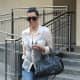 Kim Kardashian in tight jeans and high heels