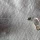 One of only two crimps used to create necklace closure before covered with crimp cover.