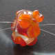 Close-up of bead threaded for crimpless attachment.