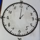 Once we had the hours and minutes in place, I called out a time and he wrote the hour and minute hands on the clock. I took these pictures.