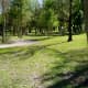 Shaded paths near children's playground in Archbishop Joseph A. Fiorenza Park