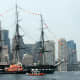 U.S.S. Constitution in Boston Harbor, with tug boat.