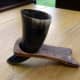 Viking drinking horn in its stand and ready for use.