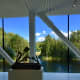 Large panoramic windows open up to lots of natural light and beautiful views of nature and the trout river, Randselva. In the foreground is Pedro Reyes's sculpture &quot;Navaja Suiza VIII (Swiss Army Knife VIII)&quot;, 2014.