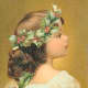 Little girl with Christmas holly crown 