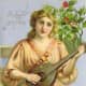Angel with Christmas holly