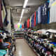 Inside the shop with rows of branded goods
