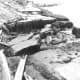 Landslide and slumping damage to State Highway 287, along the shore of Hedgen Lake. Montana, caused by the August 18, 1959, earthquake. (Photograph by J.R. Stacy.)