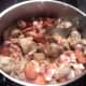 Adding the "chouriço" and bacon