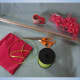 Gather your gift basket supplies: clear cellophane, scissors, ribbon, tape, and tissue paper.