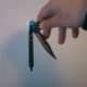 Let bite handle and blade dangle.