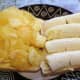 Adding the crisps to the bread