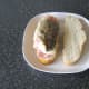 Cod fillet is placed skin side up on bacon rashers