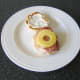 Pineapple roll is laid on middle bacon