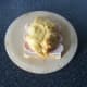 Chicken breast is laid on top of turkey bacon