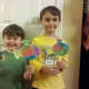 My boys proudly showing off their coffee filter fish!