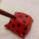 Paint black spots with the end of a paintbrush.