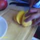 Cut into slices on all sides close to the pit.