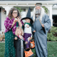 A Harry Potter family costume featuring Dumbledore, Professor Trelawney and two adorable witches.