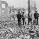 Soldiers in San Francisco 1906 ruins. Soldiers from the Presidio stand amid the rubble of fallen buildings after the earthquake. The Hall of Records (dome) is in the background (right).