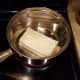 In another medium pot, start melting your cream cheese over medium-low heat.