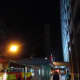 The tall building in the background is clearly visible against the night sky.