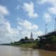 View of Phra That Chedi from Boat on the Mekhong
