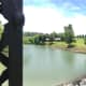 Panorama view of mill, river, and bridge.
