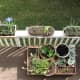 A bird's eye view of our first floor balcony, where we have a total of 4 rail planters, plus our movable planter platform.