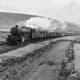 Ex-LMS 4-6-0 Patriot class 'Howe' takes a mixed freight on the Settle &amp; Carlisle Railway through the Pennines