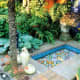 colorful Italian mosiacs inspired by Spanish and Moroccan courtyards make a water feature that is soothing and cheerful