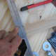 Mark the desired length on the stake. If you have a carpenter's square draw a line across it. If not use your gardeners best eye and another stake to draw the line with