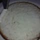 Create a dam: You just want to go around the perimeter of the cake to hold the filling in place.