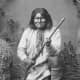 This photo of Geronimo kneeling with his rifle taken in 1887 -