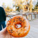 A sugar-glaze donut with sprinkles on top