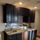 Basement bar cabinets I sprayed with Pro Industrial water-based alkyd enamel in the gloss finish. This product is from Sherwin Williams.
