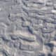Frozen ripples lying on the shoreline of Lake Michigan on Pier Cove Beach in SW Michigan