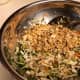 Add toasted noodles and almonds to the cabbage mixture.