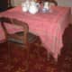 The table and chairs where the little girl is seen