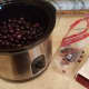 Pit all of your cherries and pop them into the crockpot.
