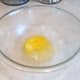 Add an egg to your mixing bowl.