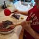 Step Seven: Fold in the chocolate chips, leaving a handful for topping the brownies.