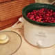 I started by pouring my fresh cranberries into my small crockpot.