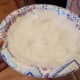 Start with your crust first so it can cook while you're making the filling. The trick to this recipe is making your coconut oil ice cold. I smear mine on a plate into a thin even layer and pop it into the freezer.