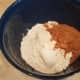 Add your flour and sugar to a large mixing bowl.